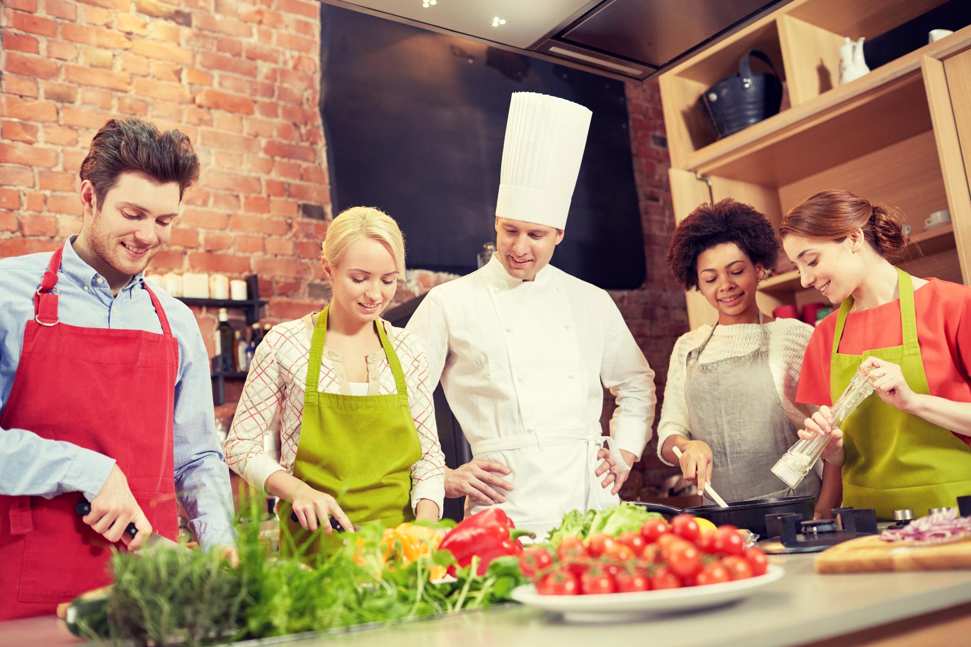 Group cooking in modern kitchen